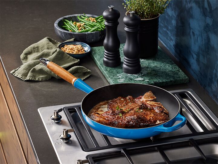 T bone with Black Garlic Butter and Fine Green Beans Le Creuset IE
